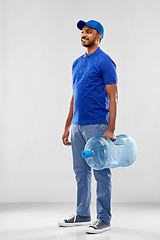 Image showing happy indian delivery man with water barrel