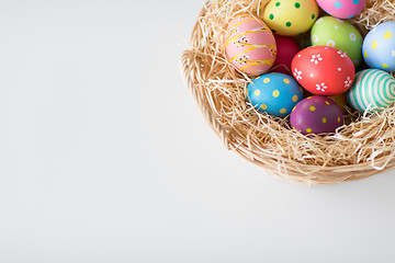 Image showing close up of colored easter eggs in basket