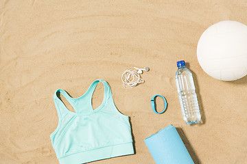 Image showing sports top, mat, fitness tracker and water bottle