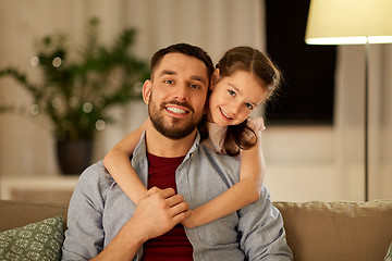 Image showing happy father and little daughter hugging at home