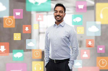 Image showing indian businessman with app icons at office