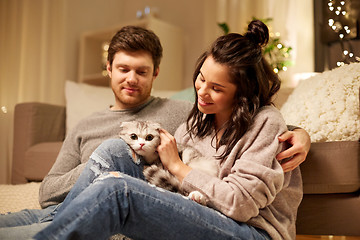 Image showing happy couple with cat at home