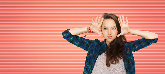 Image showing happy teenage girl making face and having fun