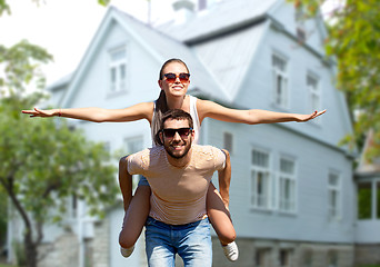 Image showing happy couple having fun in summer over house