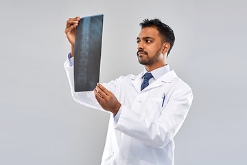 Image showing indian doctor looking at spine x-ray