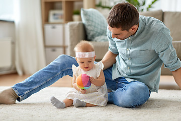 Image showing father and little baby daughter with ball at home