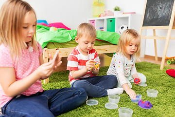 Image showing children with modelling clay or slimes at home