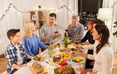 Image showing happy family having dinner party at home