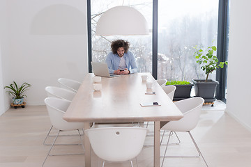 Image showing Young casual businessman using smartphone