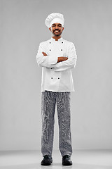 Image showing happy male indian chef in toque