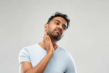 Image showing indian man suffering from sore glands or tonsils