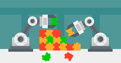 Image showing Two robotic arms building a colorful puzzle.