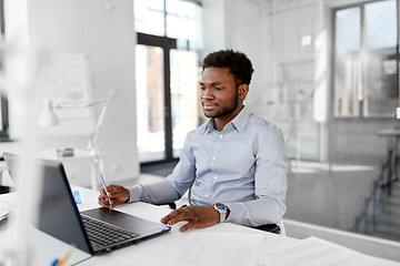 Image showing african american businessman with laptop at office