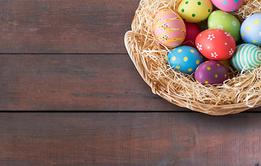 Image showing close up of colored easter eggs in basket