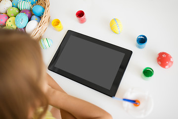 Image showing girl with tablet computer, easter eggs and colors