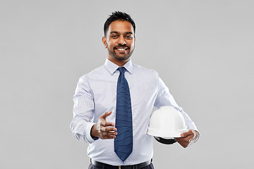 Image showing architect with helmet giving hand for handshake