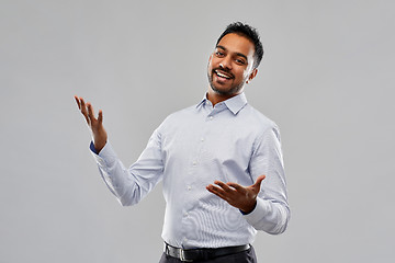 Image showing happy indian businessman in shirt over grey