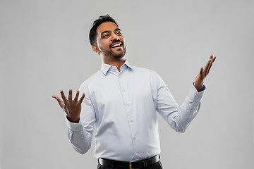 Image showing happy indian businessman in shirt over grey