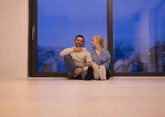 Image showing happy couple in front of fireplace