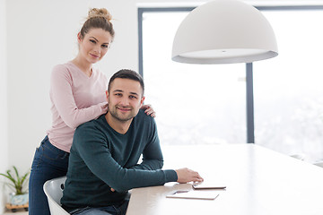 Image showing couple hugging in their new home