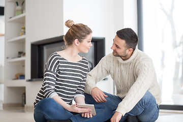 Image showing Young Couple using digital tablet on cold winter day