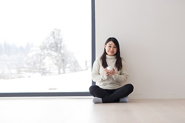 Image showing asian woman enjoying morning coffee