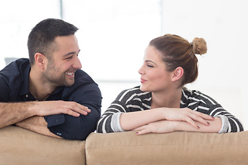 Image showing Portrait of young couple sitting on sofa