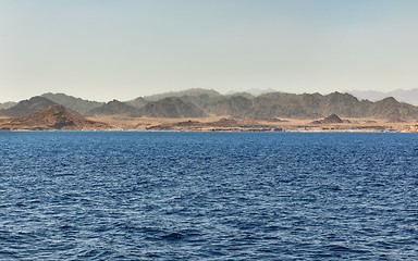 Image showing land over the horizon under blue sky