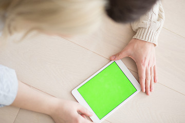 Image showing Young Couple using digital tablet on cold winter day