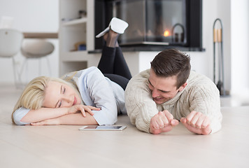 Image showing Young Couple using digital tablet on cold winter day