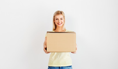 Image showing happy woman holding cardboard box