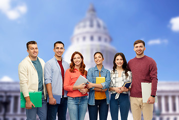 Image showing group of smiling students over capitol building