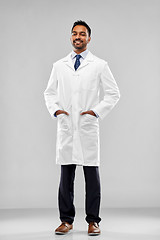 Image showing smiling male doctor or scientist in white coat