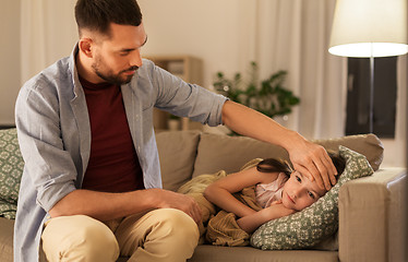 Image showing father taking care of ill daughter at home