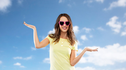 Image showing teenage girl in heart-shaped sunglasses