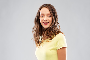 Image showing young woman or teenage girl in yellow t-shirt