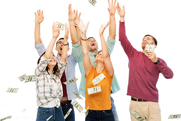 Image showing happy friends picking money falling from up above