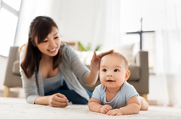 Image showing sweet little asian baby boy with mother at home