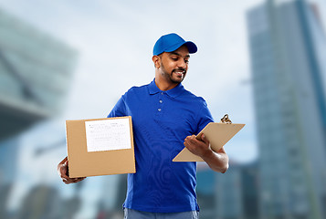 Image showing indian delivery man with parcel box and clipboard