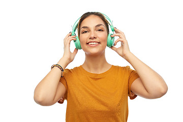 Image showing happy young woman or teenage girl with headphones