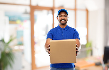 Image showing indian delivery man with parcel box at office