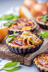 Image showing Homemade mini pies with onions.