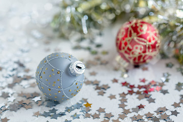 Image showing Silver Christmas ball with gold ornament.