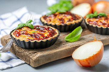 Image showing Homemade onion open mini pies.