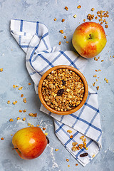 Image showing Granola with apple and raisins for breakfast.