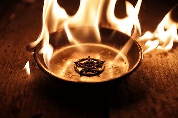 Image showing Old pentagram burning in flames