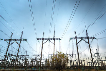 Image showing Large pylons at power distributing station