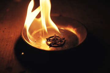 Image showing Old pentagram burning in flames