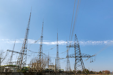 Image showing Large pylons at power distributing station