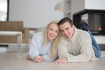 Image showing Young Couple using digital tablet on cold winter day